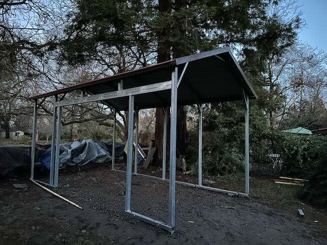 Carport with side header for access