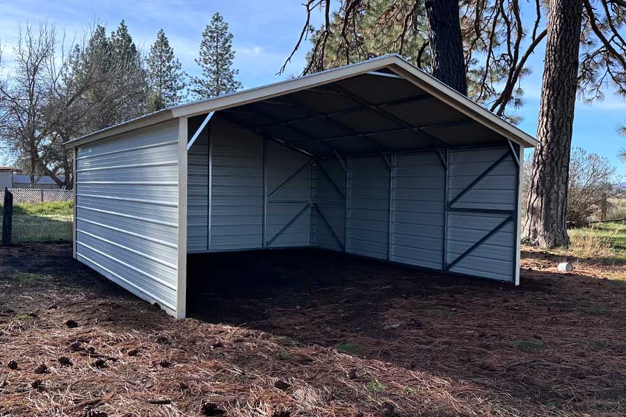 Three-sided carport used for firewood storage