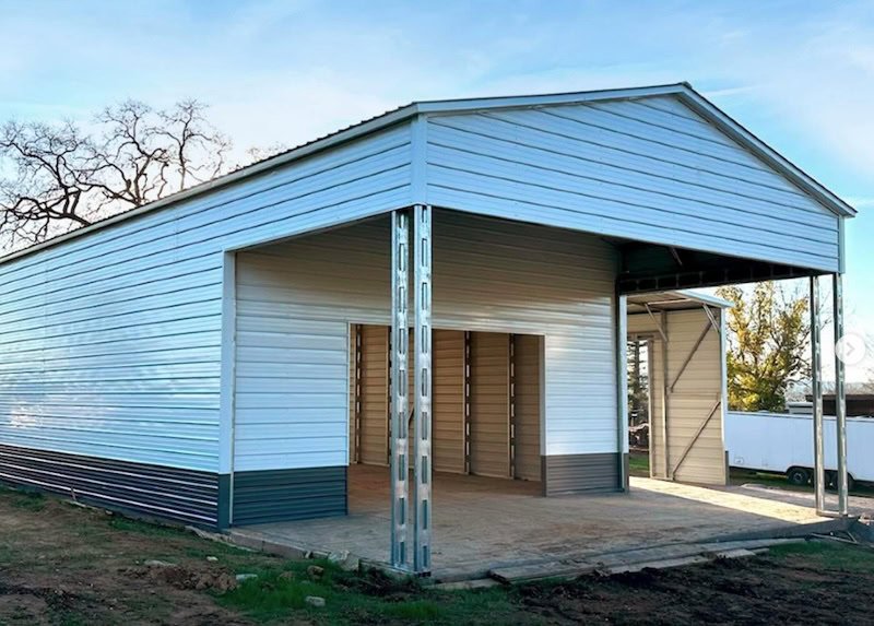 Metal garage with headers and patio area