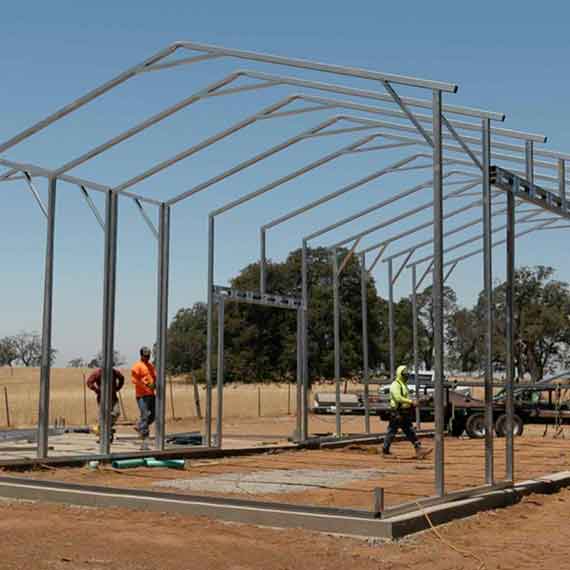 Crew installing a carport frame